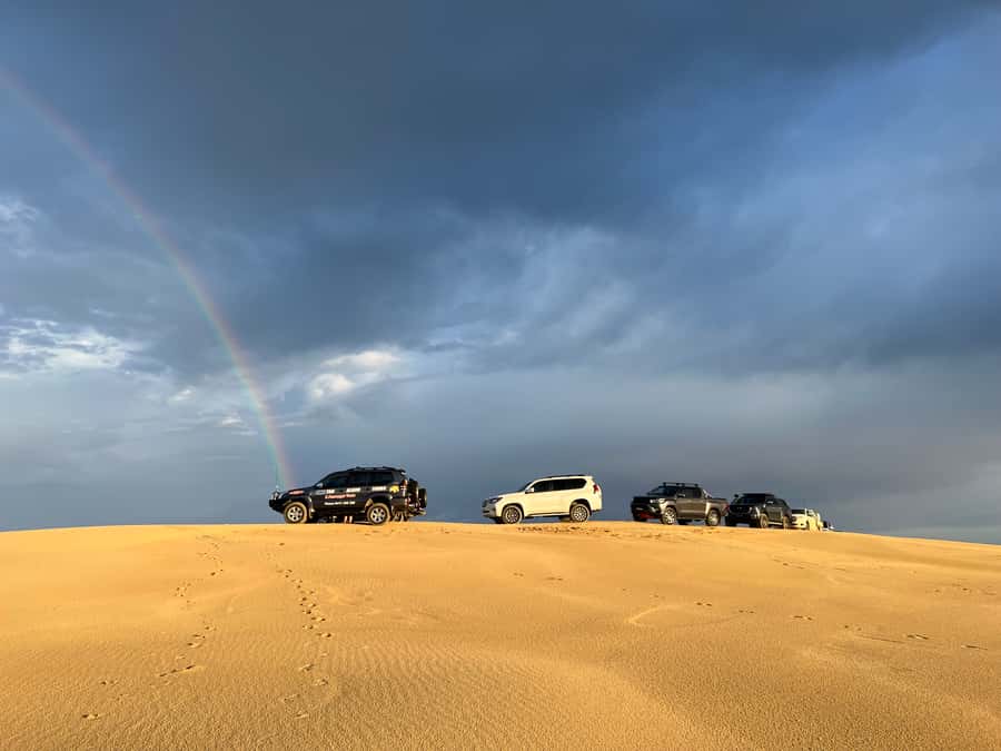 Port Stephens: Stockton Sand Dunes 4WD Tag-Along Tour - Sandboarding down famous dunes, then climbing for the views