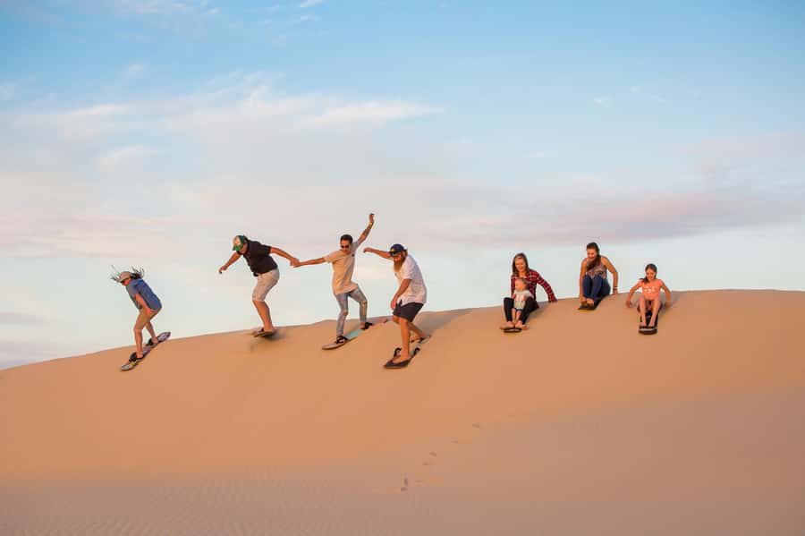 Port Stephens: Unlimited Sandboarding & 4WD Sand Dune Tour - Board instruction, sitting versus standing, and how to improve fast